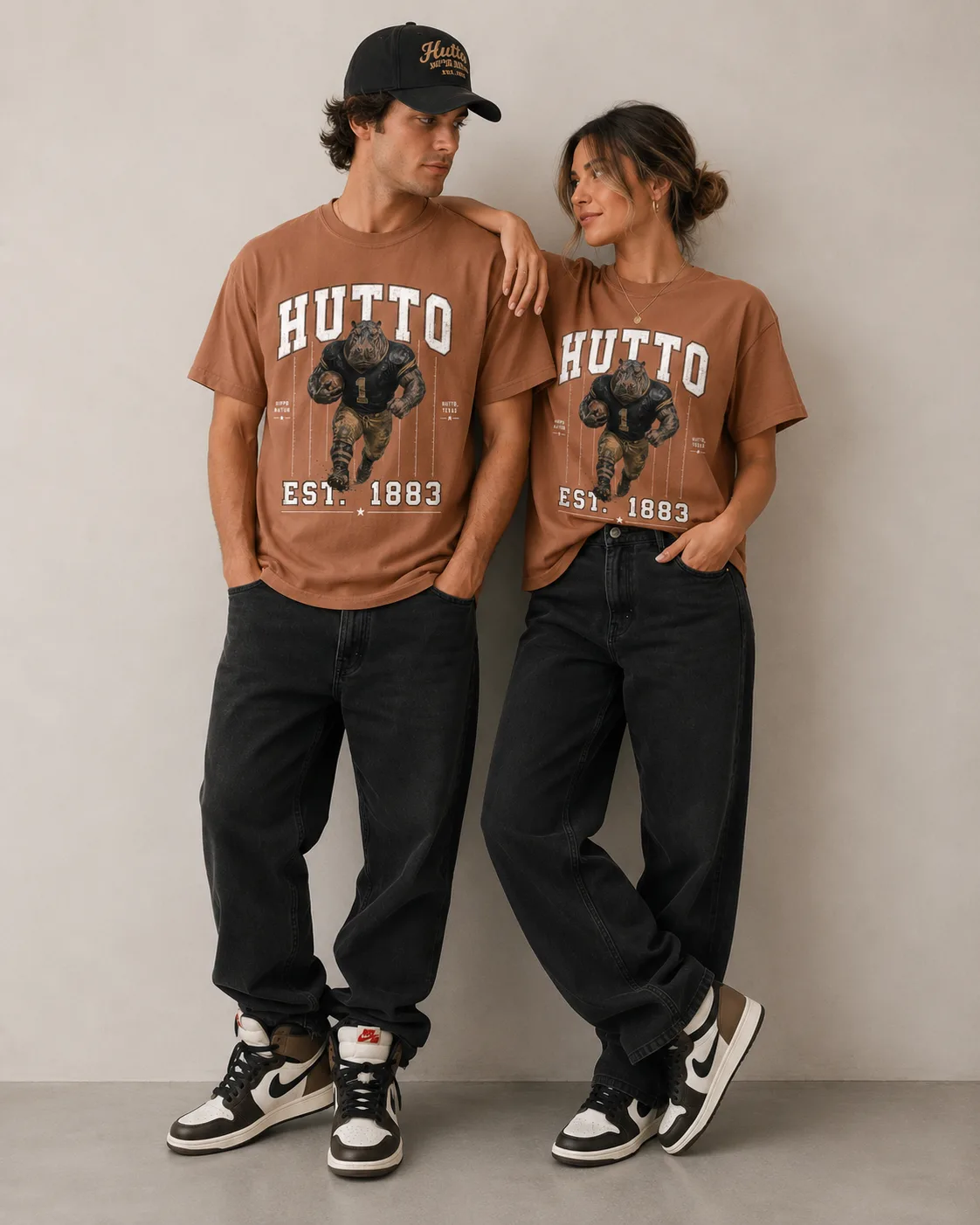 Two people wearing The 1883 Tee